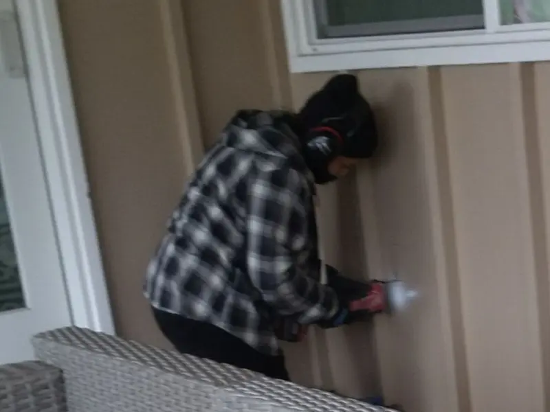 Professional electrician installing an exterior outlet in Orange